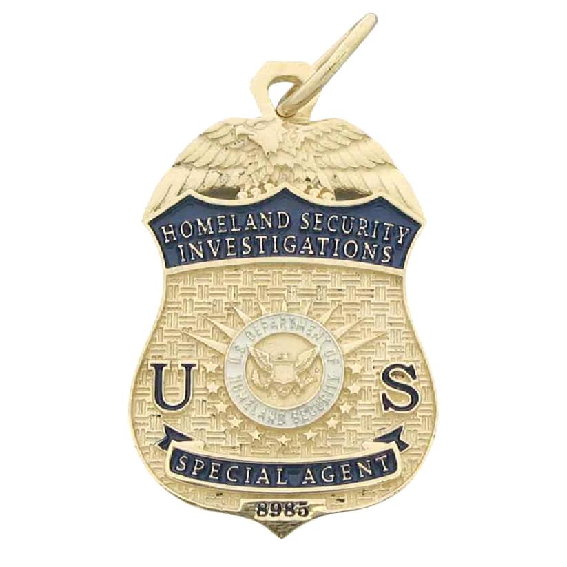 Custom U.S. Department of Homeland Security Investigations Special Agent badge pendant in 10k yellow gold with blue and white enamel.