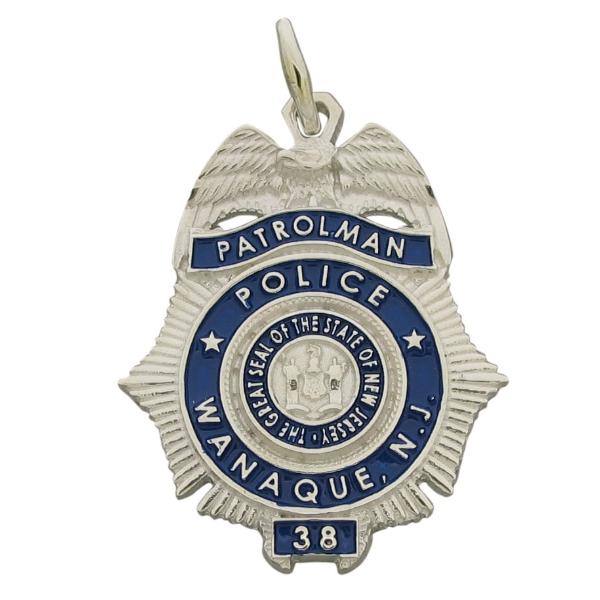 Custom Wanaque NJ Police Patrolman badge pendant in sterling silver with standing letter detail and blue enamel.