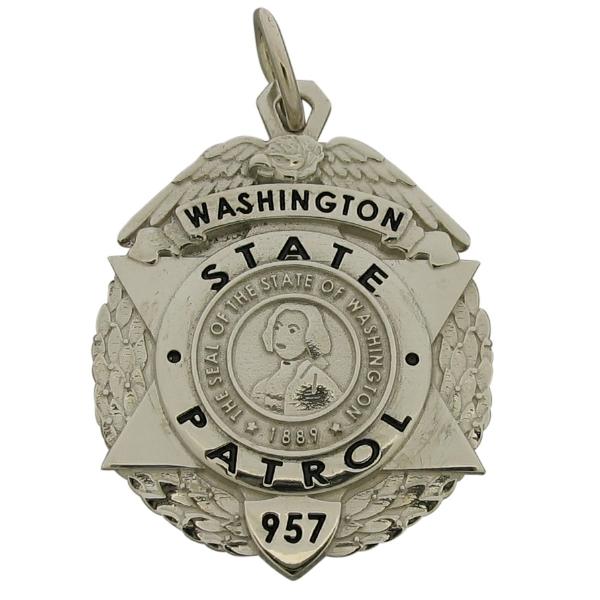 Custom Washington State Patrol badge pendant in 10k white gold with black enamel.