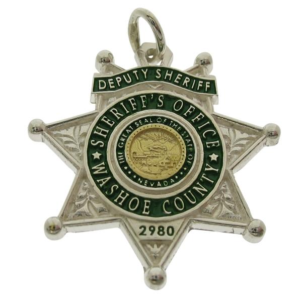 Custom Washoe County NV Sheriff's Deputy badge pendant in two tone sterling silver with raised letter detail and green enamel.