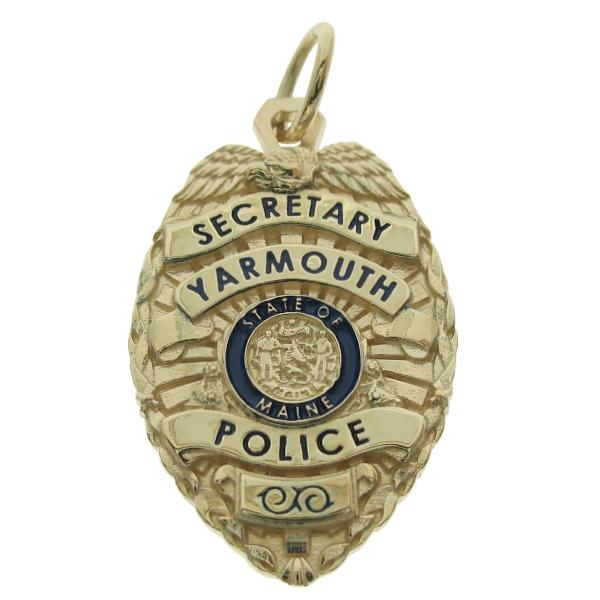 Custom Yarmouth ME Police Secretary badge pendant in 14k yellow gold with standing letter seal bezel and blue enamel.